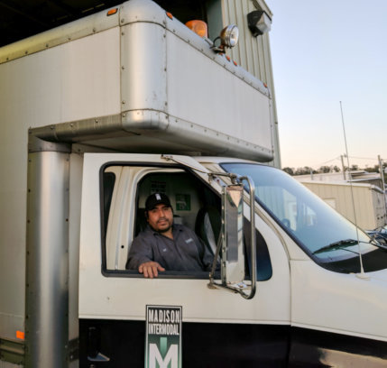 man driving a cargo truck